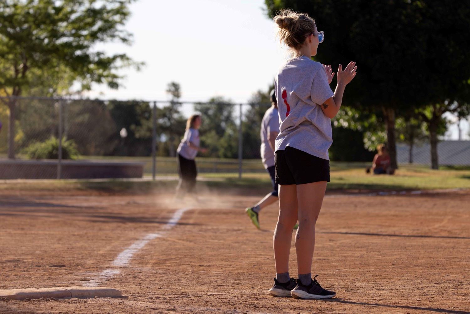 A kickball player standing in the field
