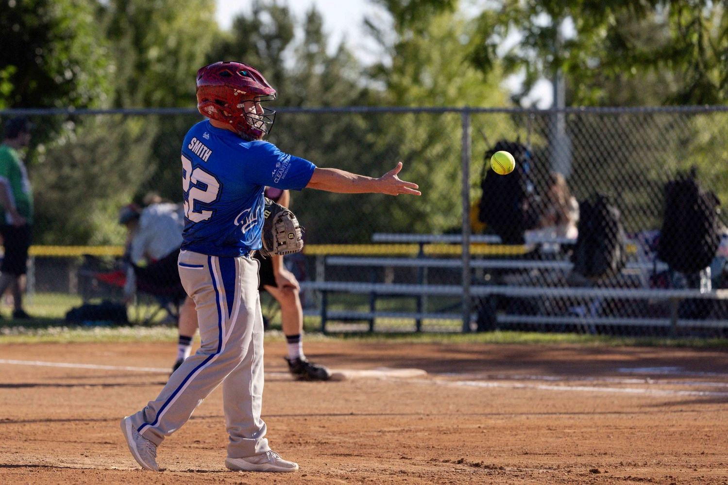 A softball pitcher throwing the ball